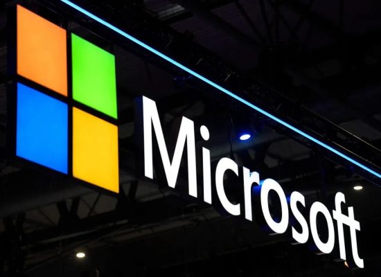 Microsoft logo on a dark background.