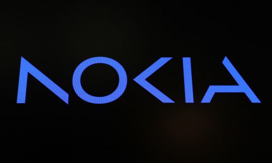 FILE PHOTO: A screen displays the company logo for Nokia Corporation on the floor of the New York Stock Exchange (NYSE) in New York City, U.S., May 24, 2023.  REUTERS/Brendan McDermid