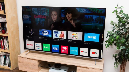 Smart TV displaying streaming apps and movie options.