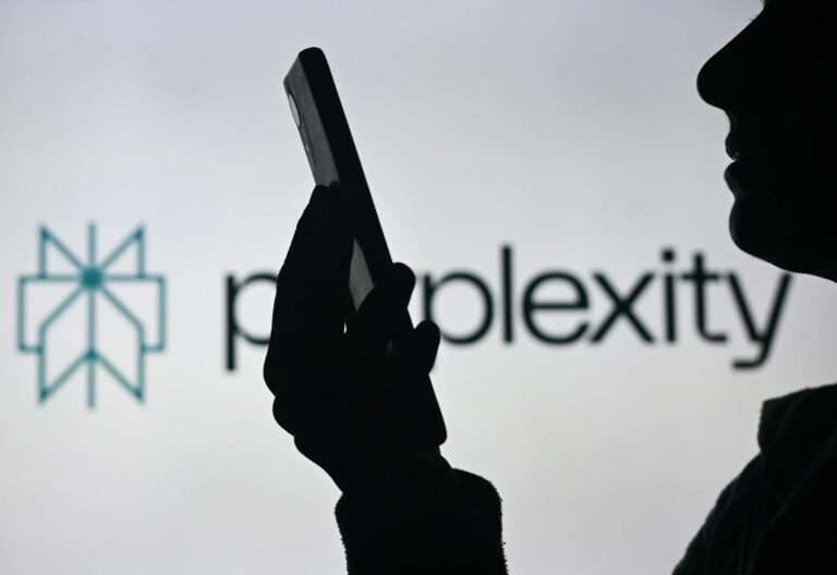 Silhouette of a person using a smartphone with "Perplexity" logo in the background.