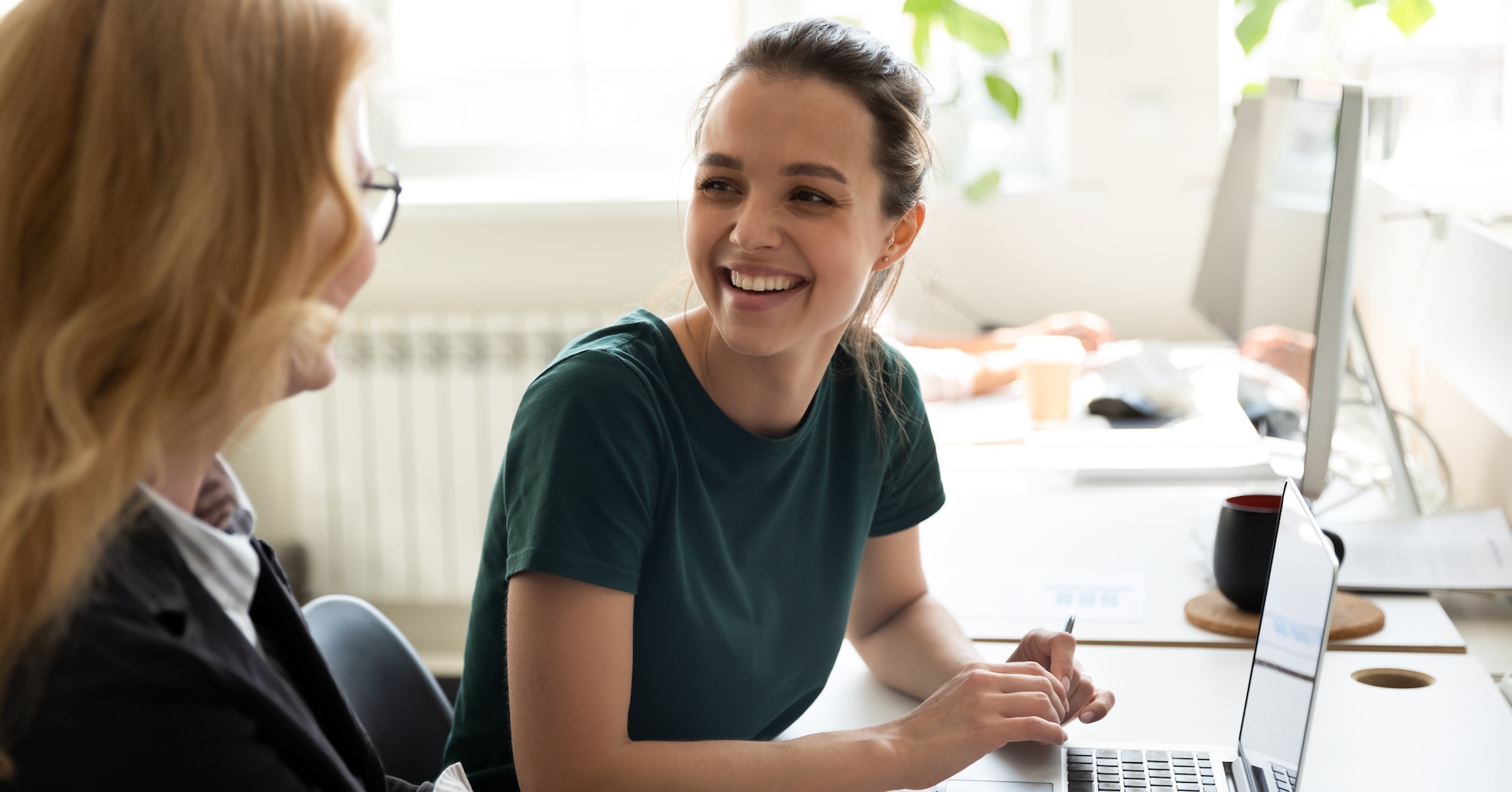 Student smiling at teacher showing AI trends.